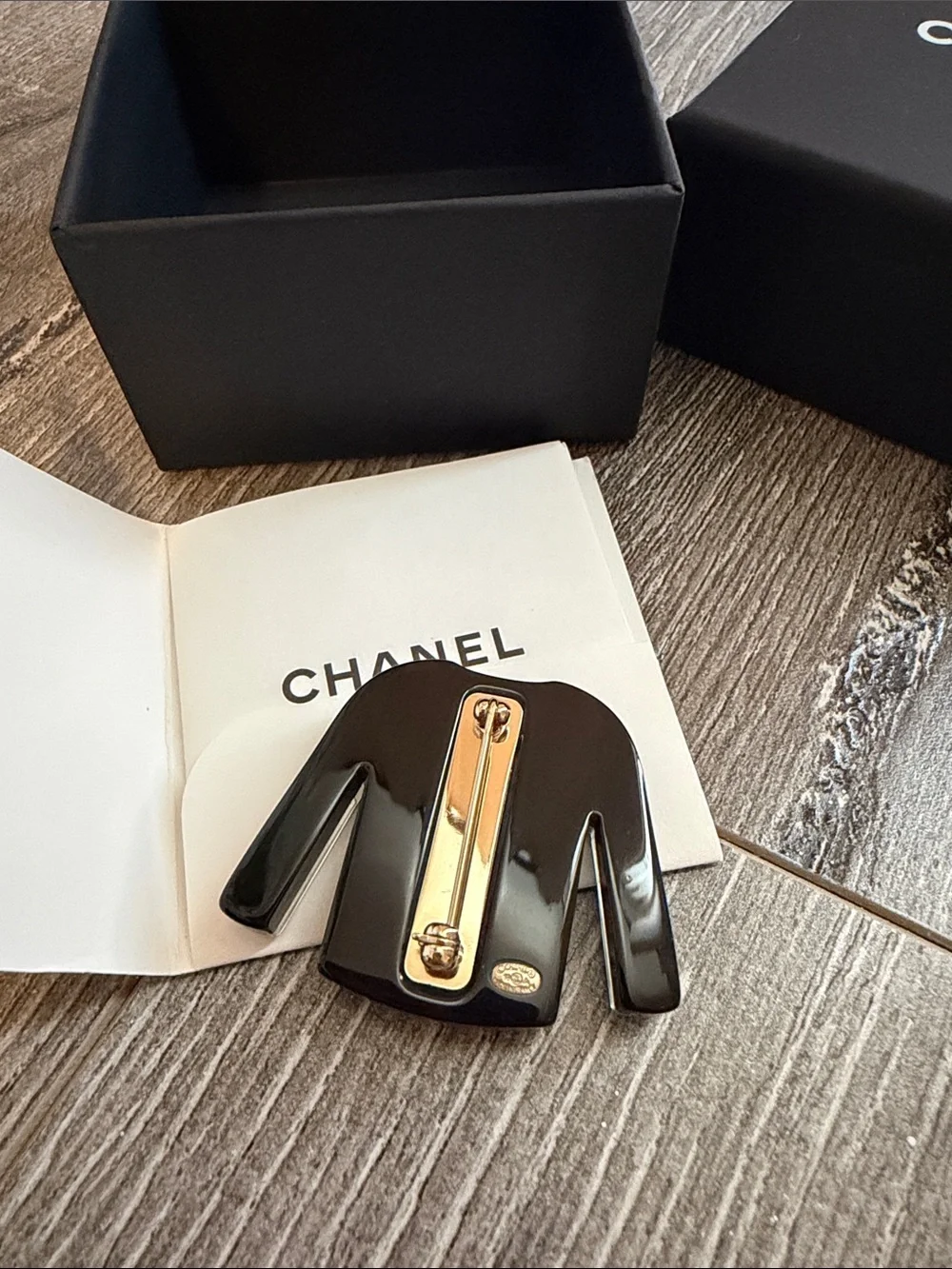 CHANEL Black & White Striped Sweater Pin with Gold CC